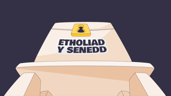 Graffeg cartŵn o flwch pleidleisio gyda'r geiriau "etholiad y Senedd" arno