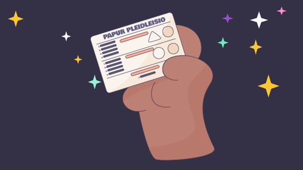 Graffeg cartŵn yn dangos llaw yn dal papur pleidleisio